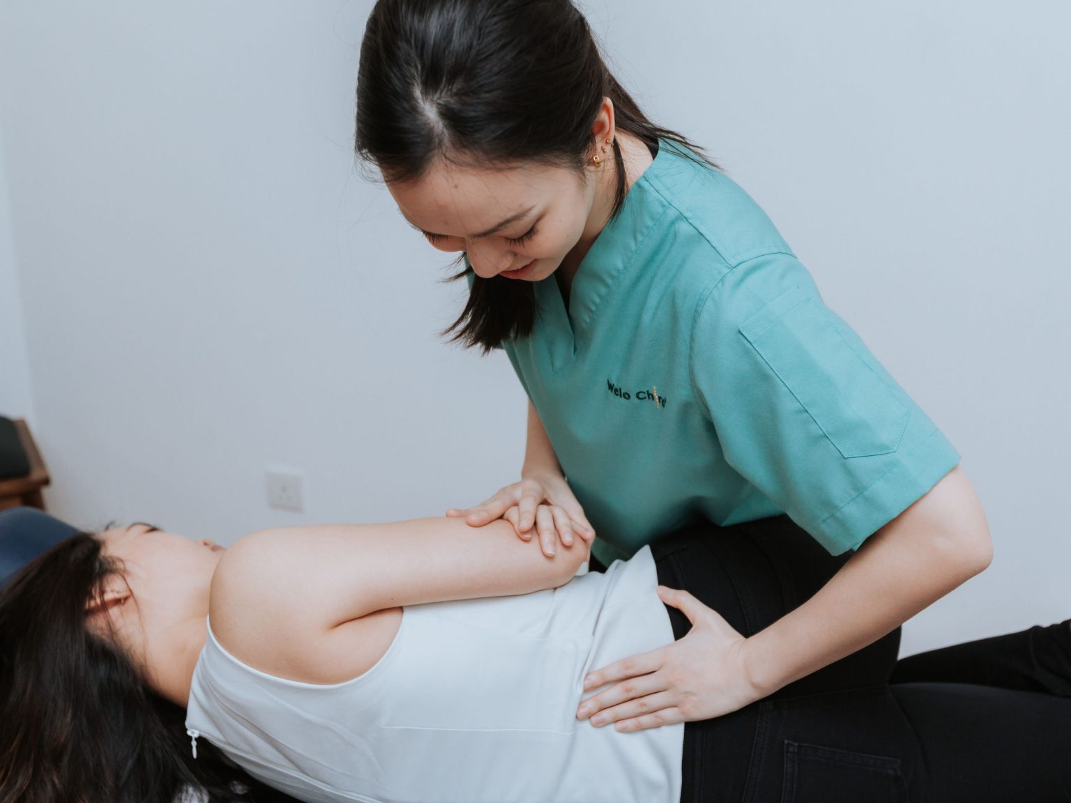 A chiropractor providing hands-on care at the Damansara Jaya centre
