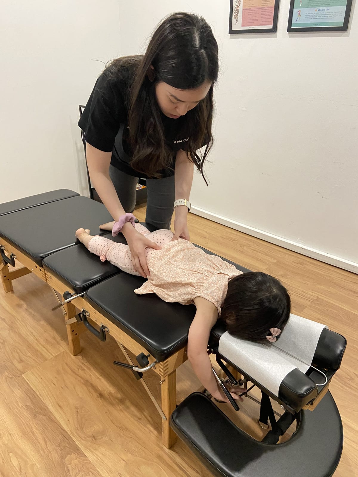 A Welo chiropractor assessing a child