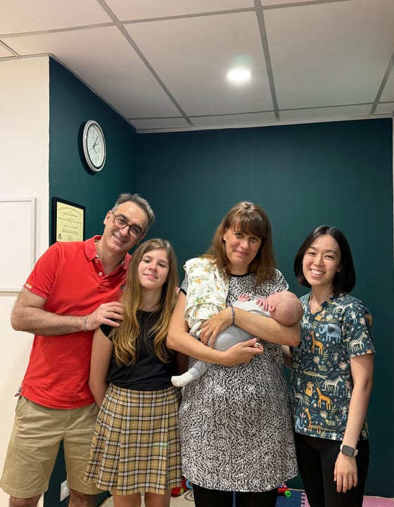 A Welo chiropractor with a family after a session