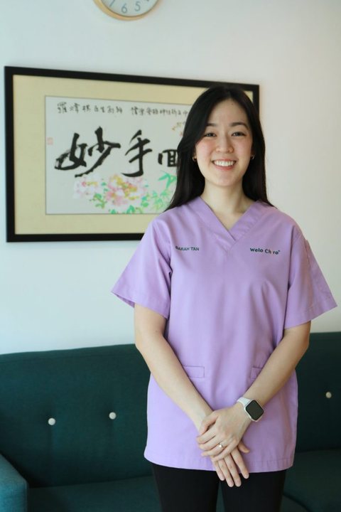 Portrait of Sarah in lavender scrubs